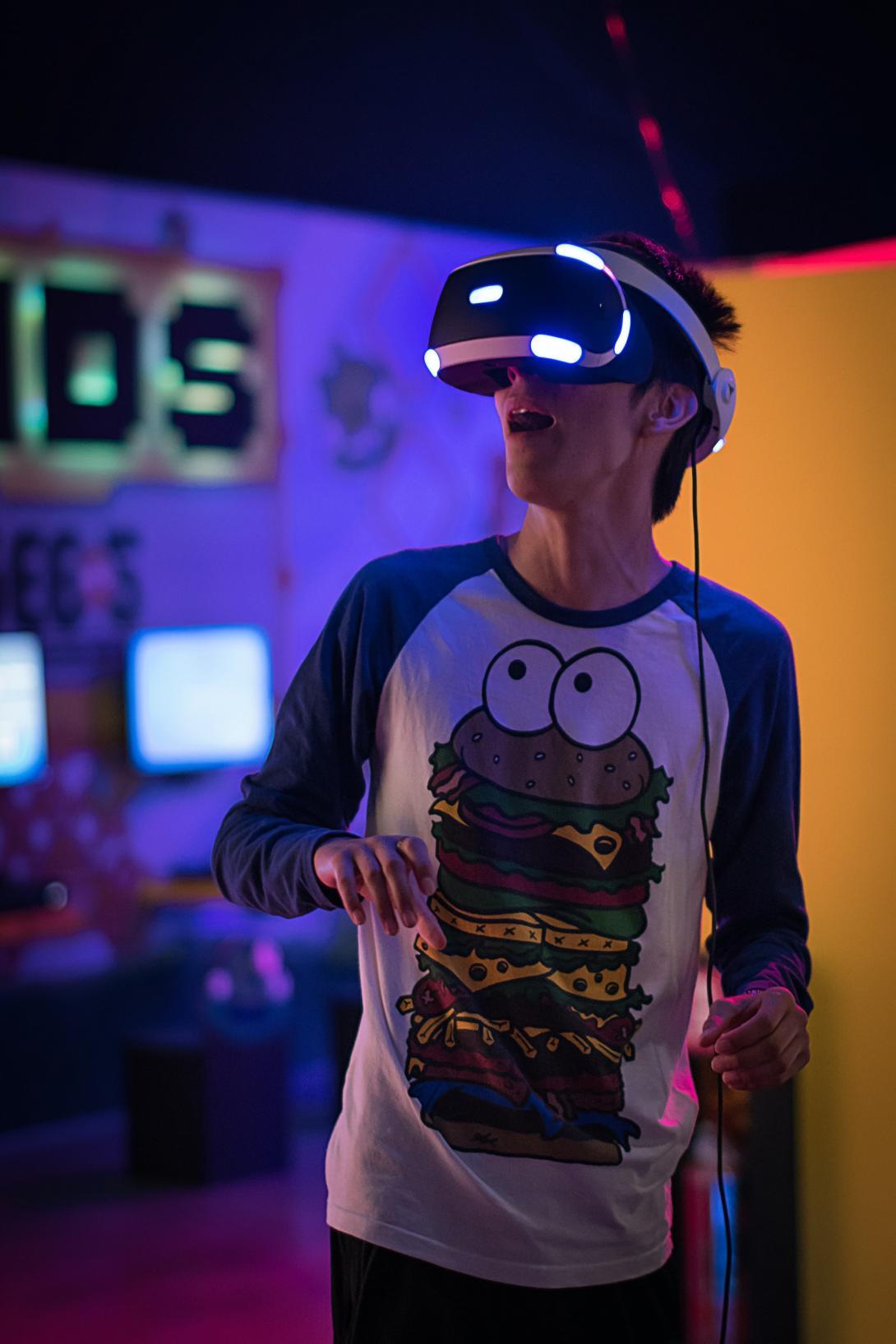 A person wearing a VR headset with a look of wonder on their face