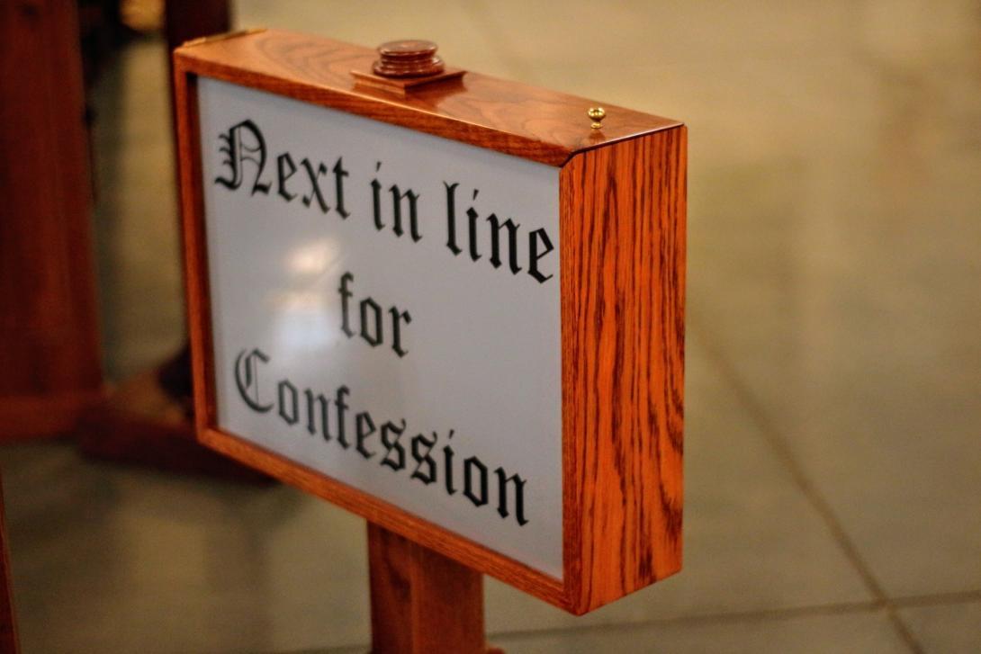 Sign that reads "Next in line for Confession"